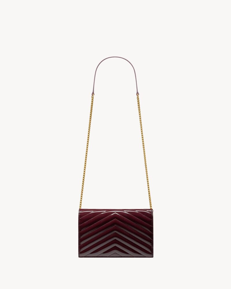 CASSANDRE envelope chain wallet in patent leather